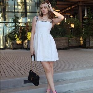 White Sleeveless Dress with Black Trim with pockets